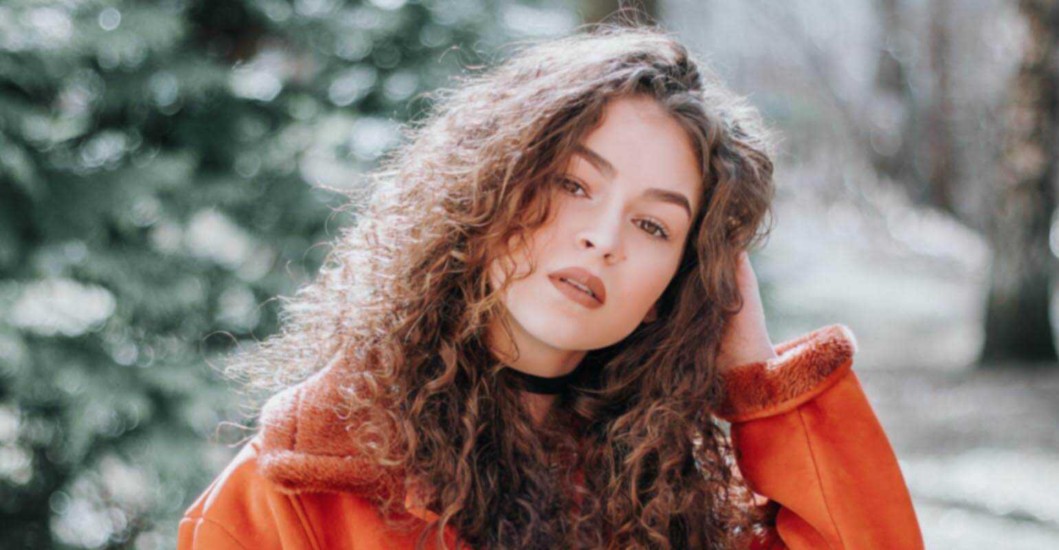 A blurry image of a woman wearing red