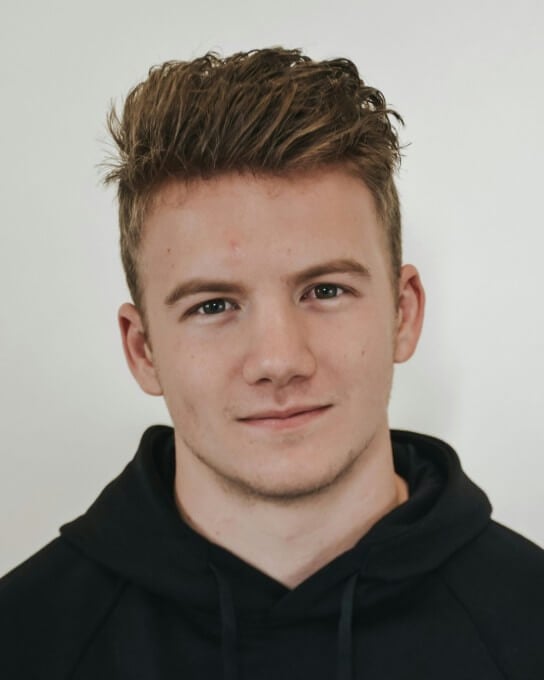 a man wearing a black hoodie