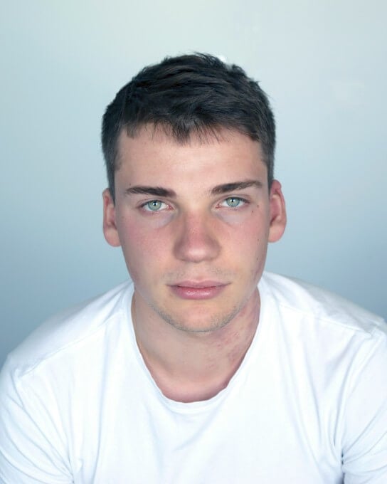 a man with ocean blue eye color in a white shirt